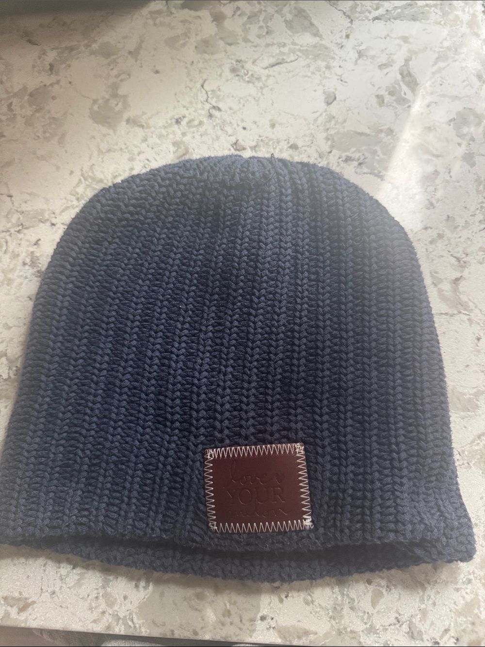 Love Your Melon navy knit beanie with brown leather patch